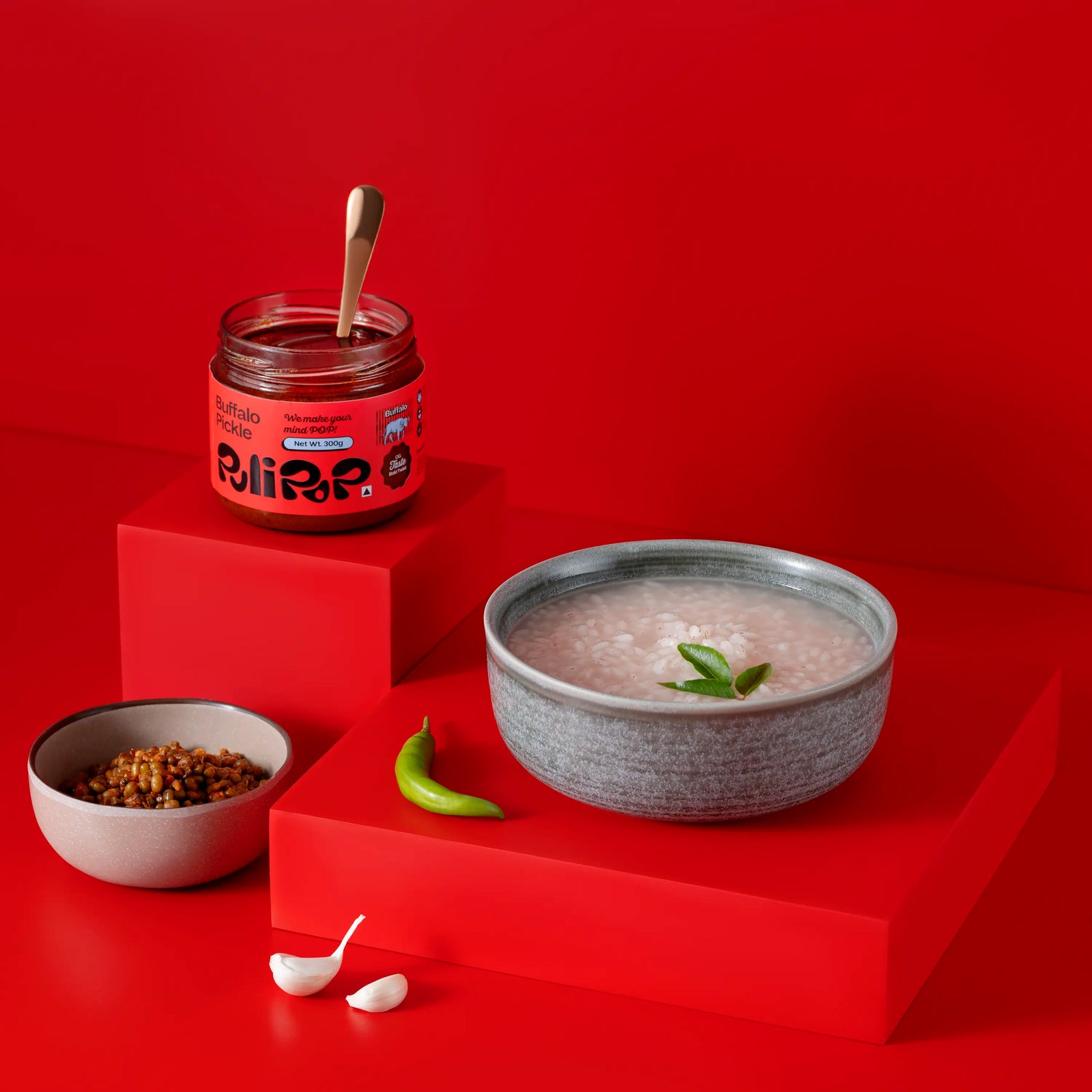 Buffalo Beef Pickle by PuliPOP with a bowl of rice kanji, lentils and curry leaves
