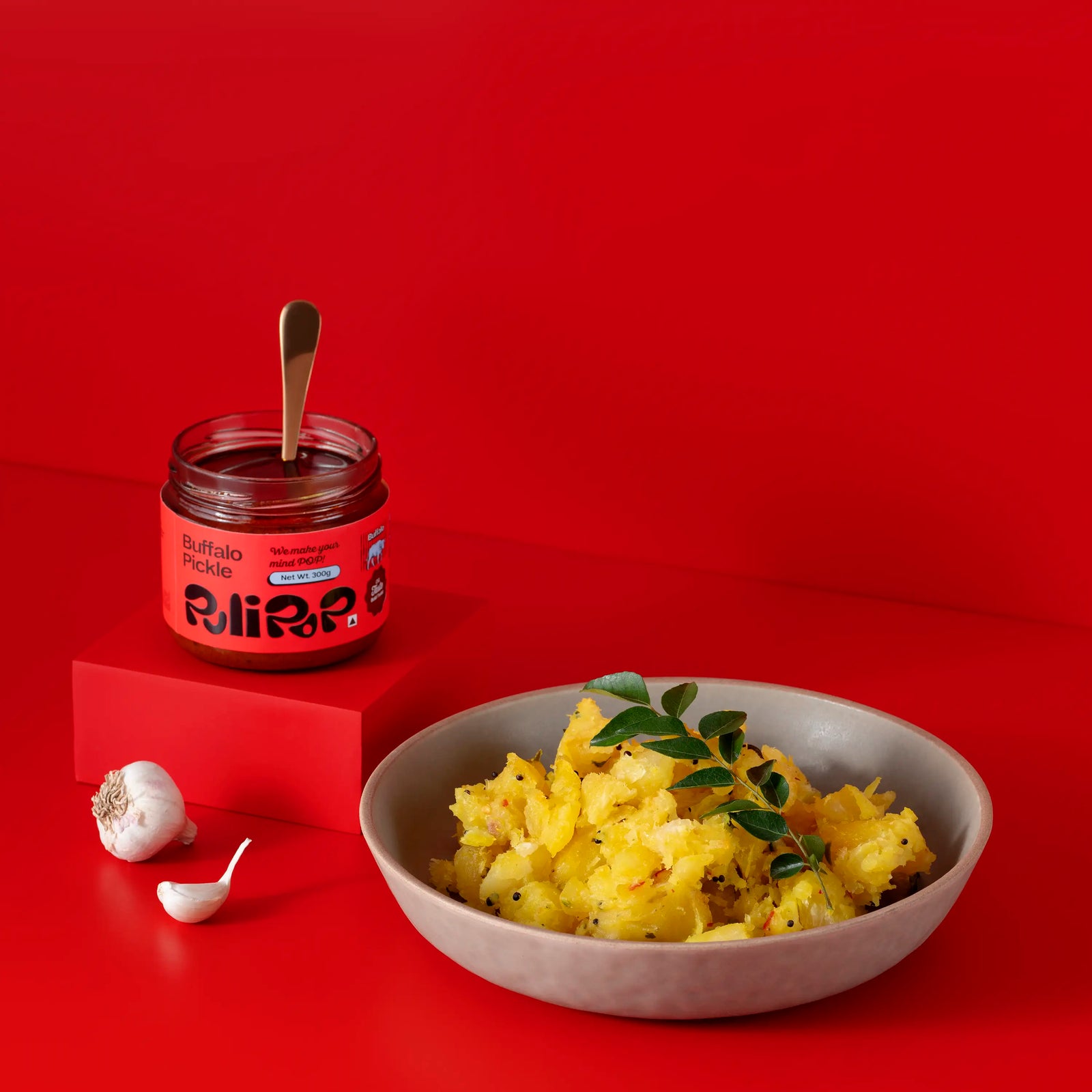 Buffalo Beef Pickle by PuliPOP with a bowl of upma, curry leaves and garlic